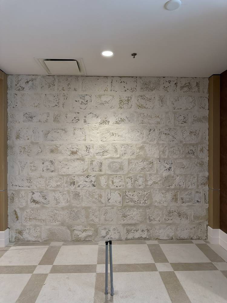 Interior German schmear mortar-wash finish over stone at a Princeton, NJ bar